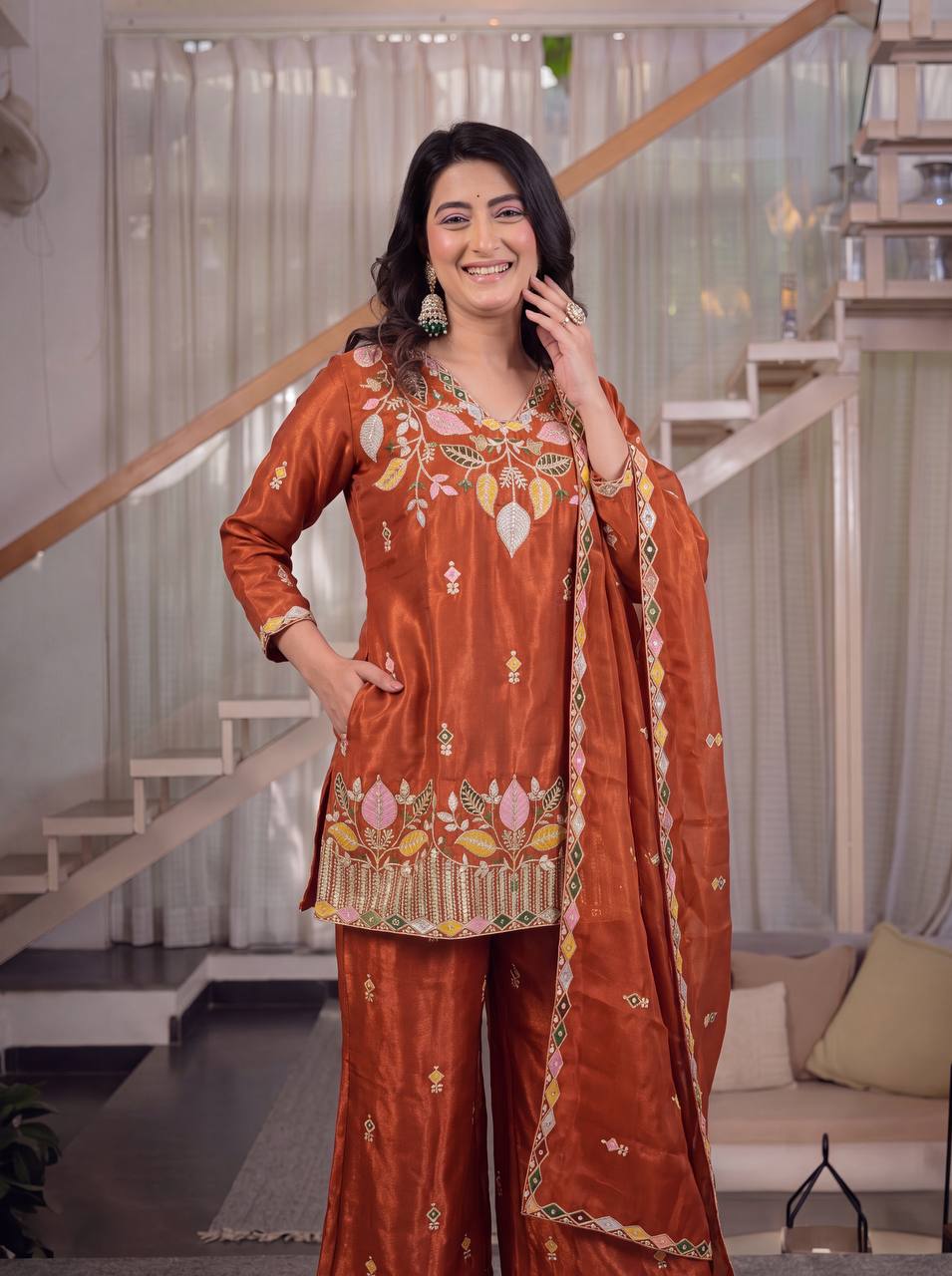 Elegant Rust Orange Silk Kurta and Flared Palazzo Set Adorned with Intricate Multicolored Botanical Embroidery and Mirror Work